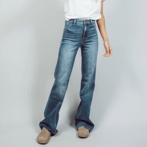 Shop Stevie Darby wide leg high rise denim medium wash jeans